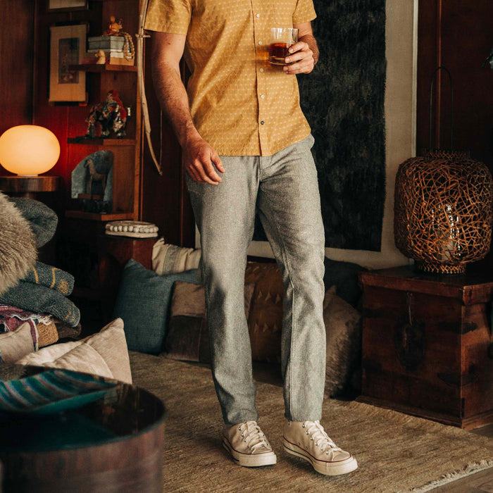 fit model walking in The Easy Pant in Olive Herringbone