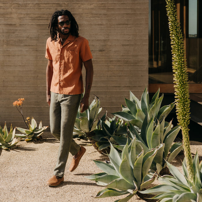 fit model walking wearing The Easy Pant in Olive Linen