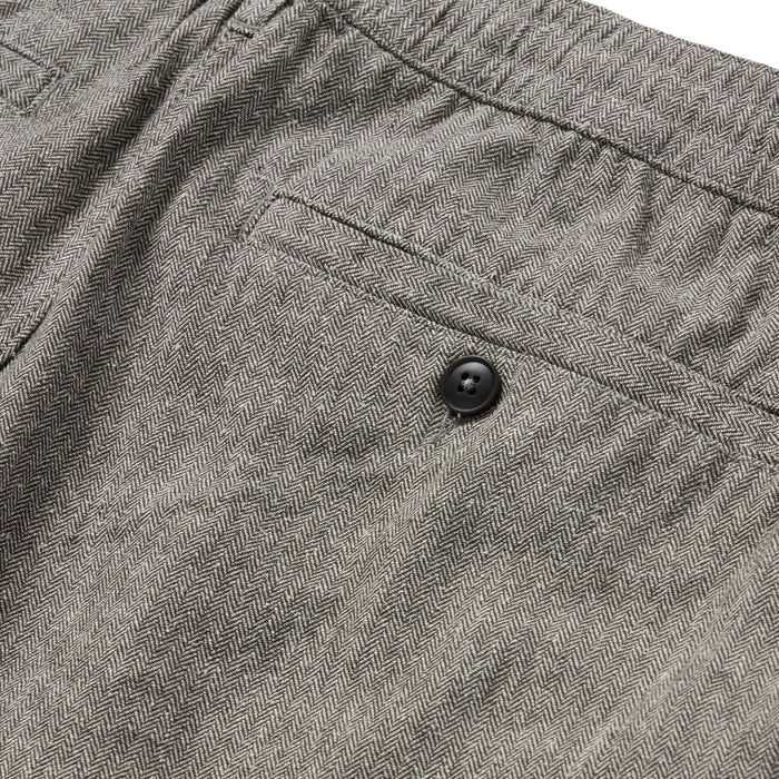 material shot of the back pocket of The Easy Short in Charcoal Herringbone