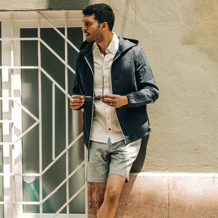 fit model wearing The Easy Short in Navy Herringbone, looking left