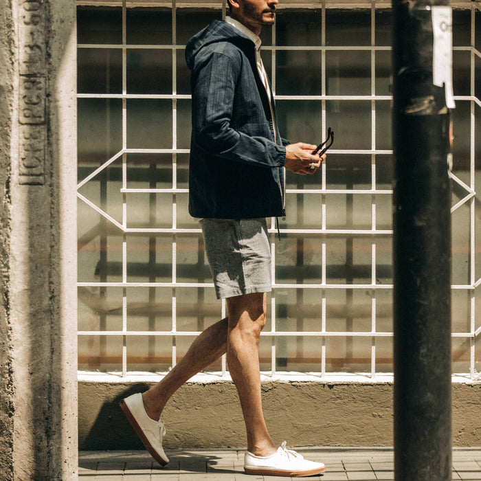 fit model wearing The Easy Short in Navy Herringbone, walking right