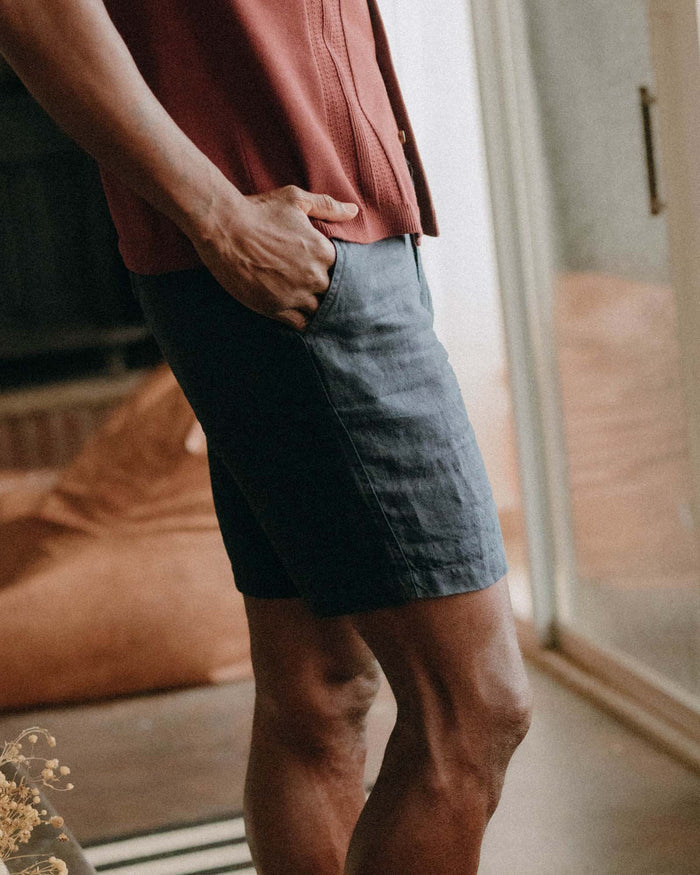fit model with his hand in his pocket wearing The Easy Short in Navy Linen