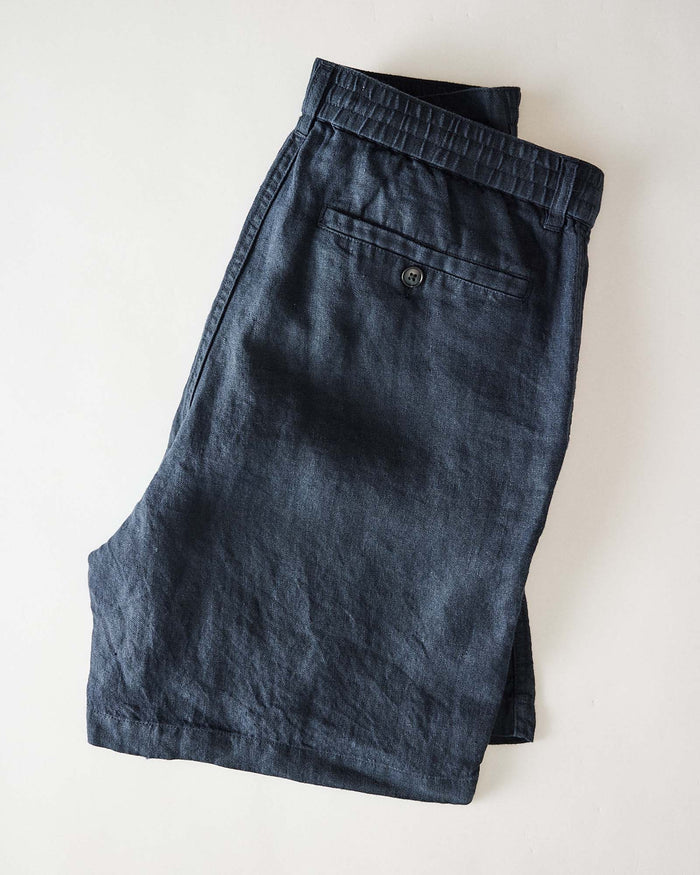 folded flatlay of the back of The Easy Short in Navy Linen