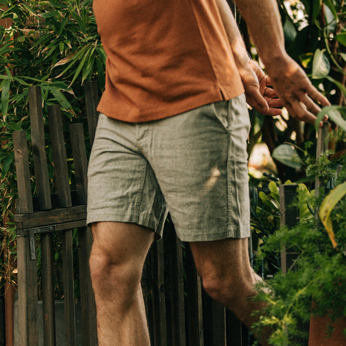 fit model walking in The Easy Short in Olive Herringbone