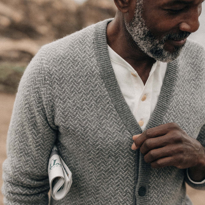 fit model showing the front of The Eddy Cardigan in Ash Herringbone Merino