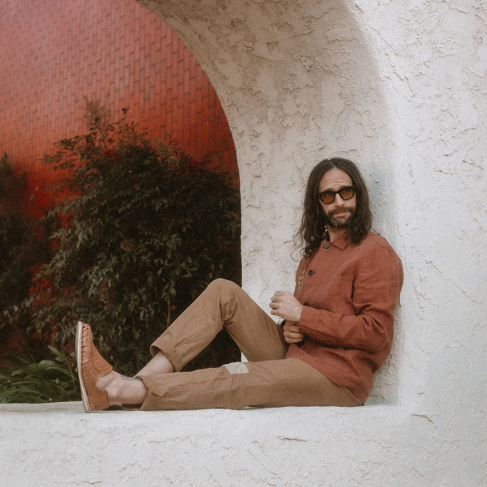 fit model sitting in The Embroidered Ojai in Dried Guajillo Hemp