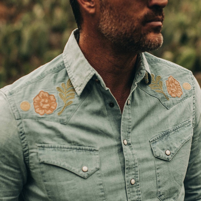 fit model wearing The Embroidered Western Shirt in Washed Denim, cropped chest shot
