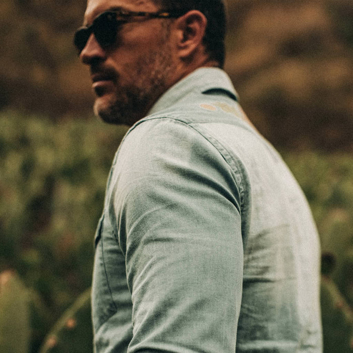 fit model wearing The Embroidered Western Shirt in Washed Denim, sleeve shot