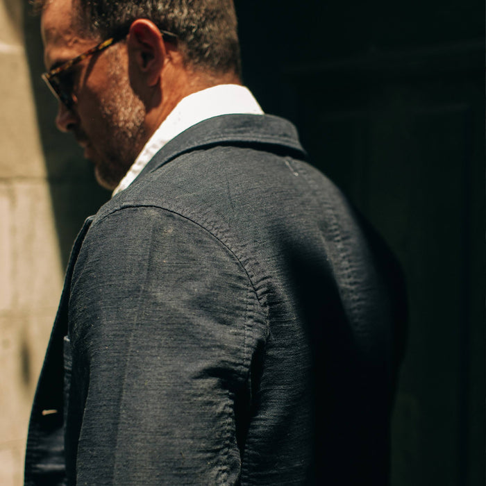 fit model wearing The Emerson Jacket in Navy Double Cloth, side profile shot