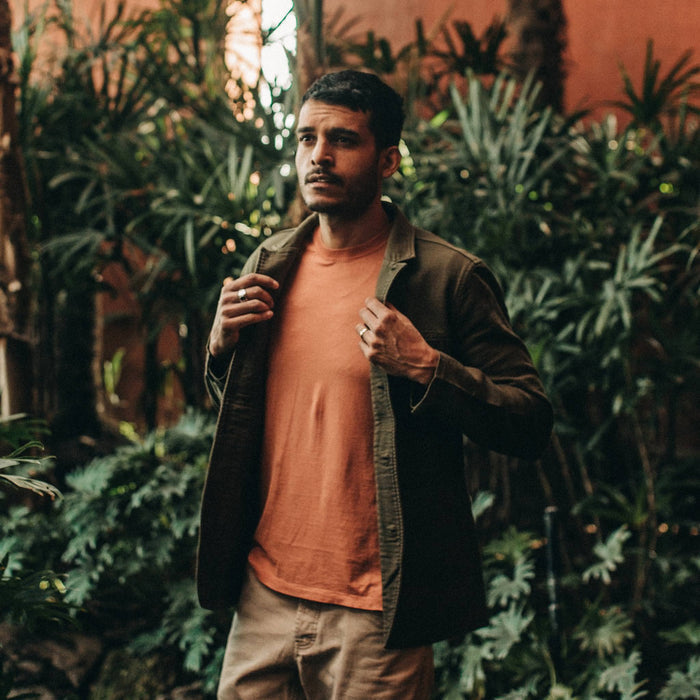 fit model wearing The Emerson Jacket in Olive Double Cloth, layered over t shirt