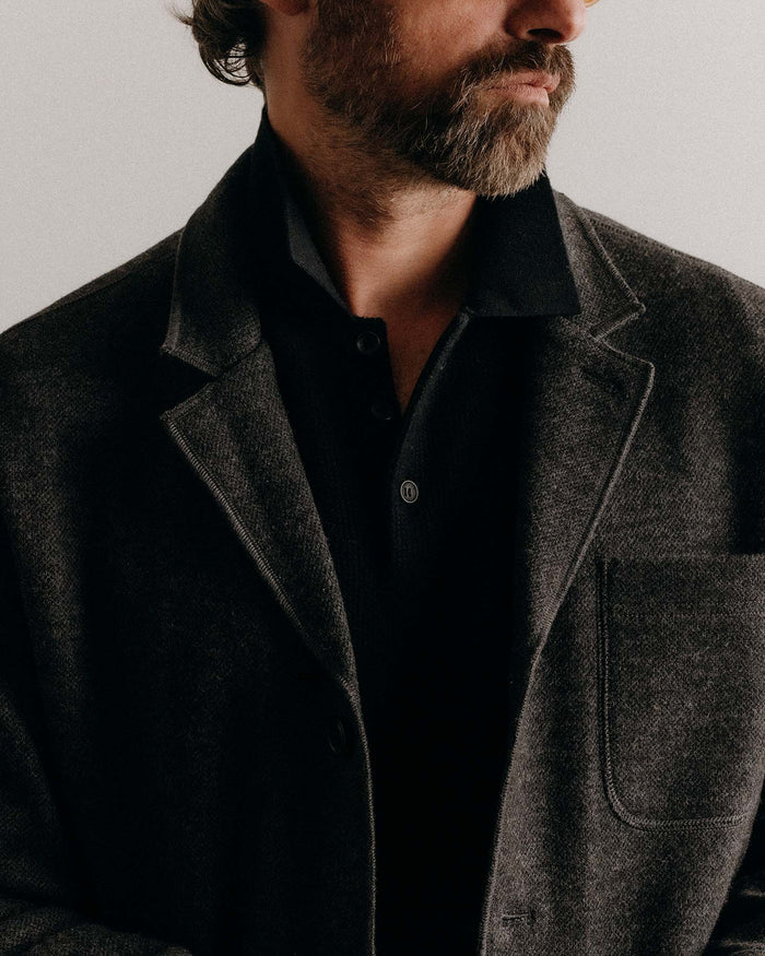 fit model showing the front lapel of The Ridgewood Cardigan in Charcoal Birdseye Wool