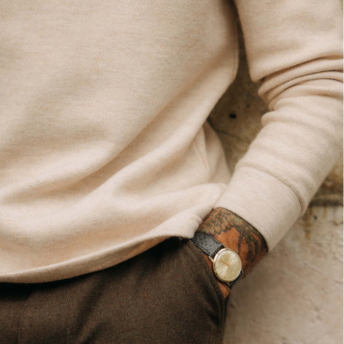 fit model in front of sea ranch in The Evans Crew in Oat Birdseye Wool