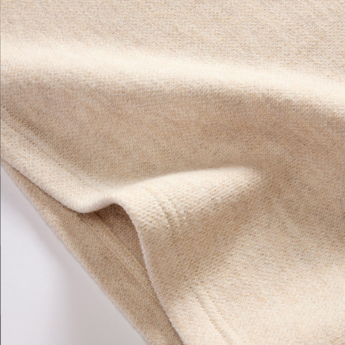 material shot of the hem on The Evans Crew in Oat Birdseye Wool