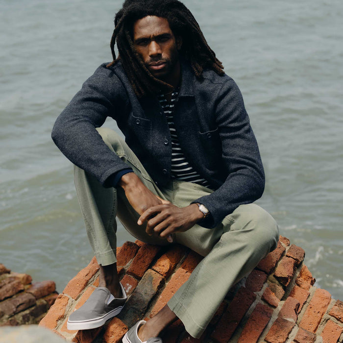 fit model sitting wearing The Evans Overshirt in Navy Birdseye Wool