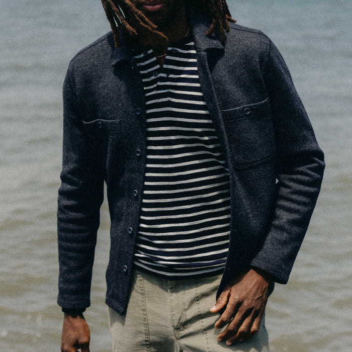 fit model walking wearing The Evans Overshirt in Navy Birdseye Wool