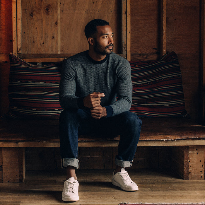fit model sitting in The Everett Sweater in Navy Birdseye