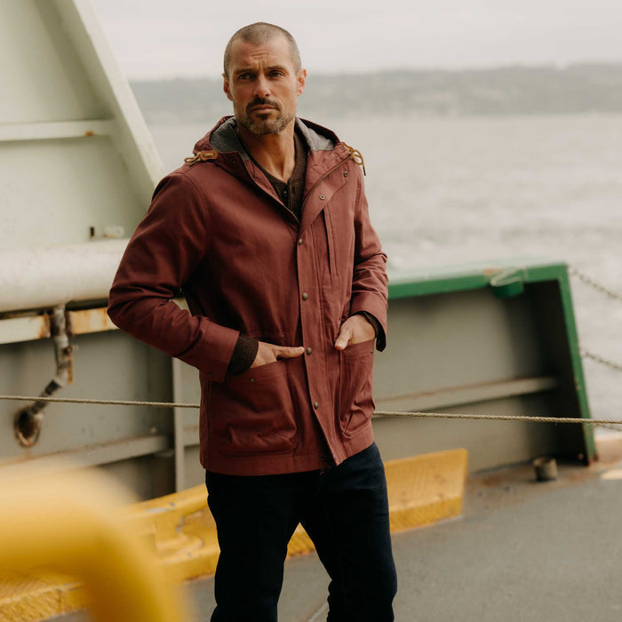 fit model posing wearing The Explorer Jacket in Red Wine Dry Wax
