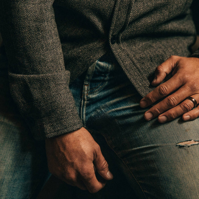 fit model wearingThe Explorer Shirt in Charcoal Herringbone, bottom shirt crop