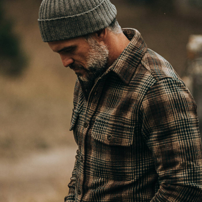 fot model wearing The Explorer Shirt in Tan Plaid, looking down