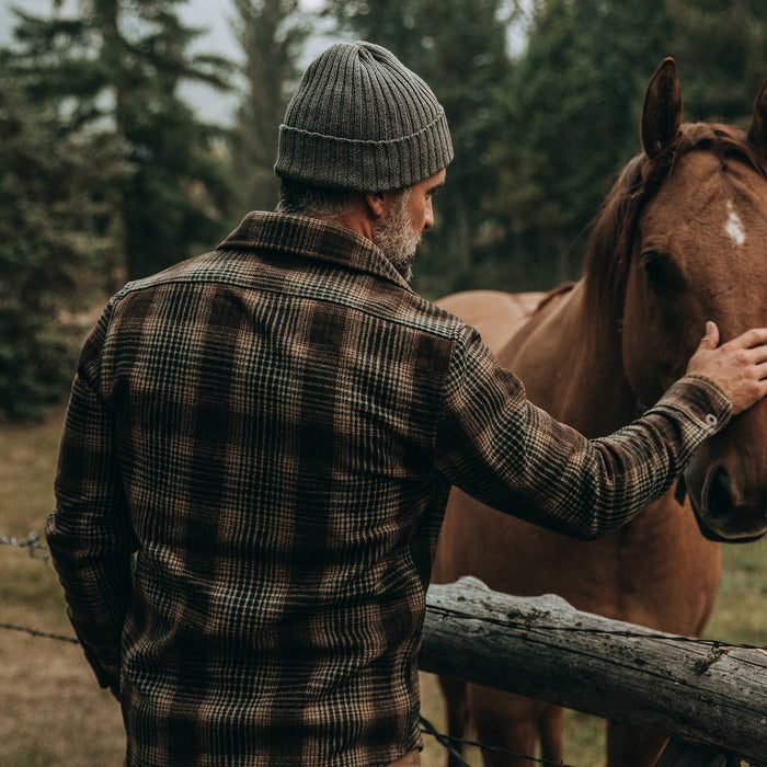fot model wearing The Explorer Shirt in Tan Plaid, petting horse