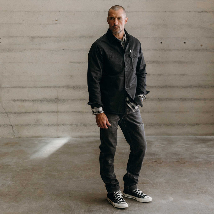 fit model posing in The Fender Jacket in Coal Dry Wax
