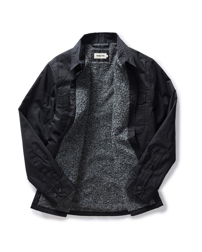 flatlay of the inside of The Fender Jacket in Coal Dry Wax