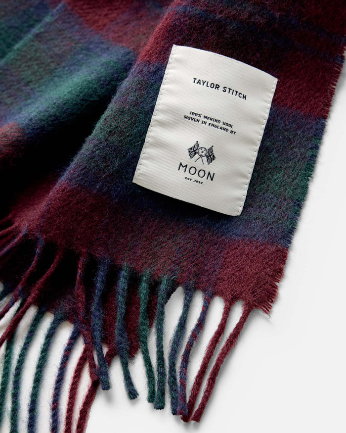 material shot of the label on The Fireside Scarf in Currant Plaid