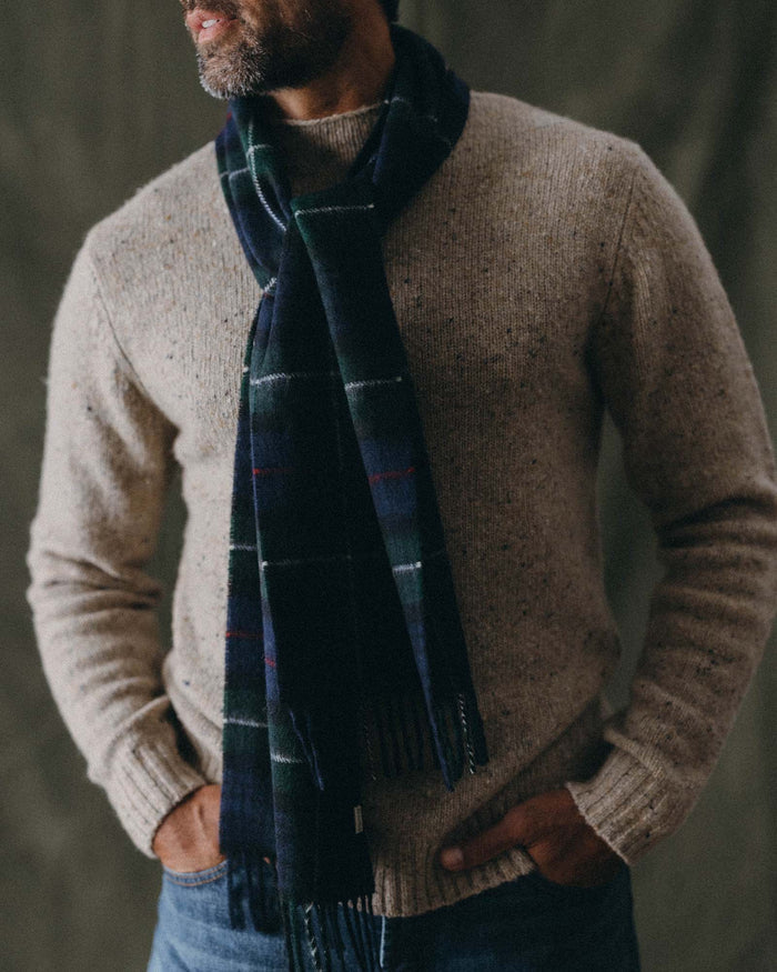 fit model posing in The Fireside Scarf in Highland Navy Plaid