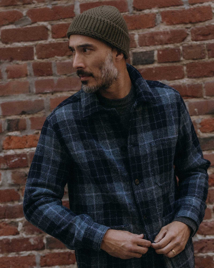 fit model posing in The Fisherman Beanie in Heather Army
