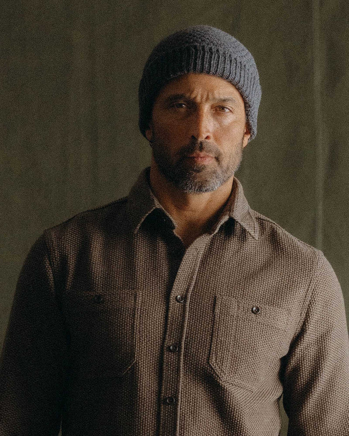 fit model posing in The Fisherman Beanie in Heather Coal