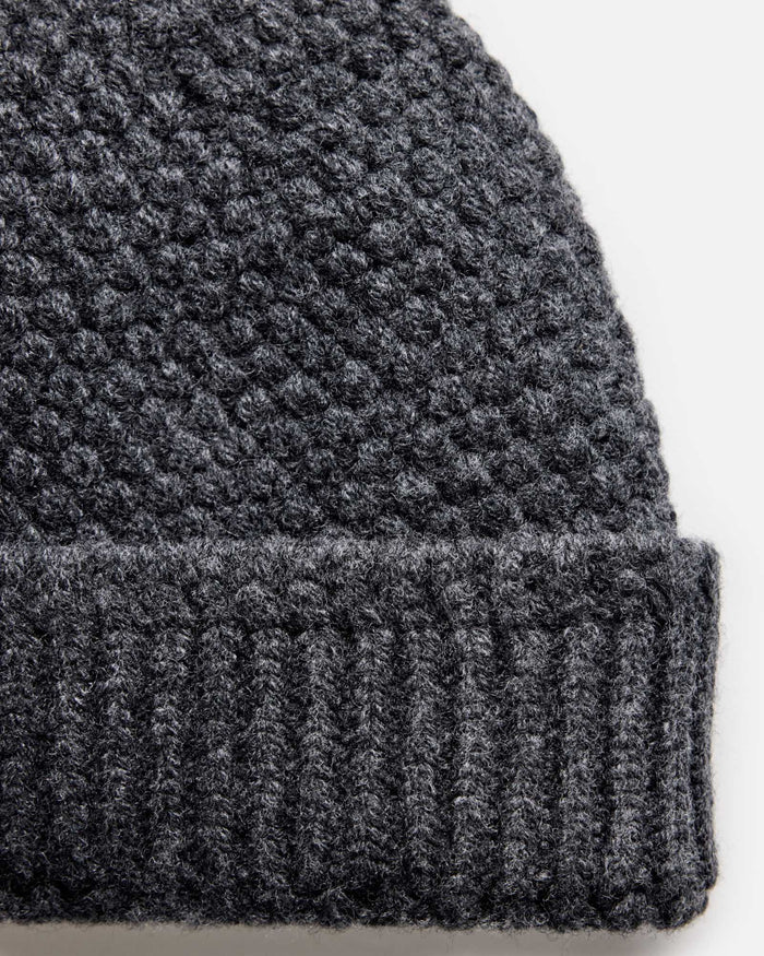 mateiral shot of the uff of The Fisherman Beanie in Heather Coal