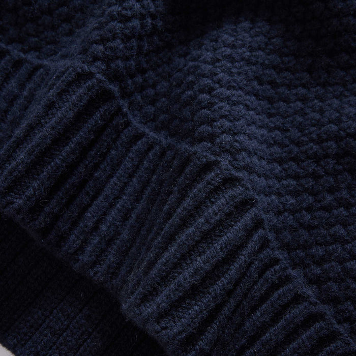 material shot of the hem on The Fisherman Sweater in Dark Navy Merino