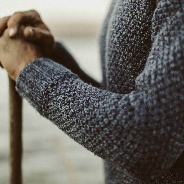 A detail shot of our fit model in the Fisherman Sweater