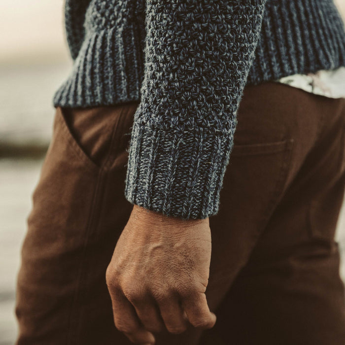 Detail shot of our fit model on the beach in out Fisherman Sweater