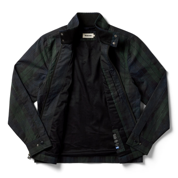 flatlay of The Flint Jacket in Blackwatch Dry Wax, shown unzipped