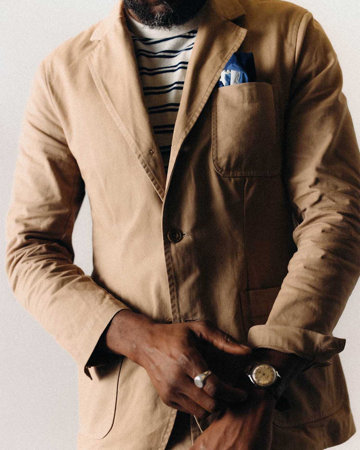 fit model adjusting the cuffs on The Foundation Sportcoat in Organic Khaki Twill