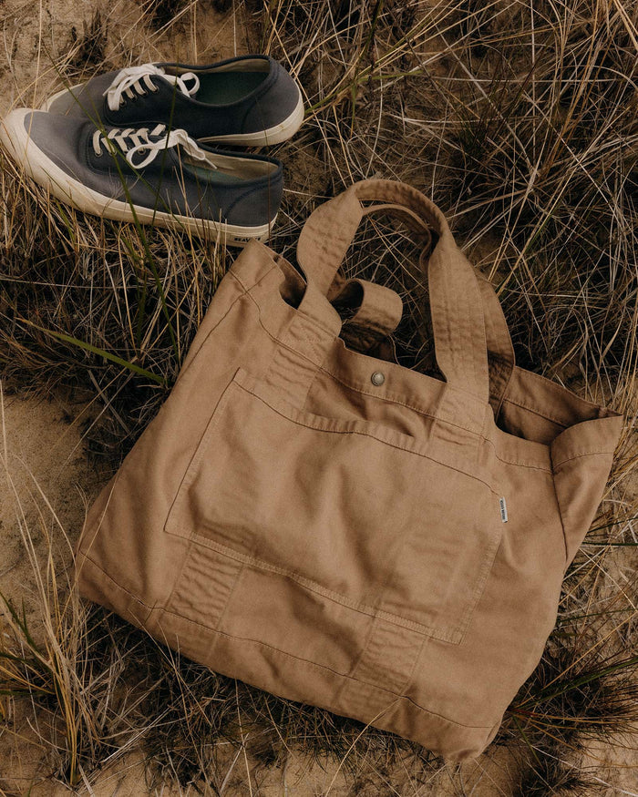 editorial image of The Foundation Tote in Organic Khaki on the sand