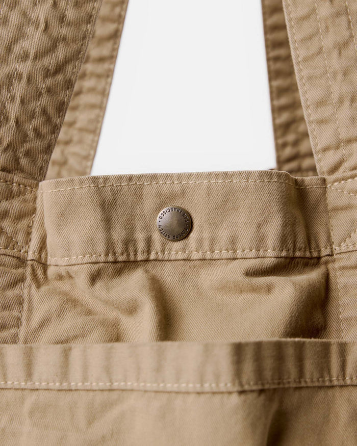 material shot of the button on The Foundation Tote in Organic Khaki
