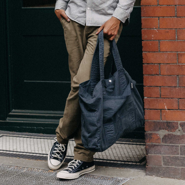fit model holding The Foundation Tote in Organic Navy