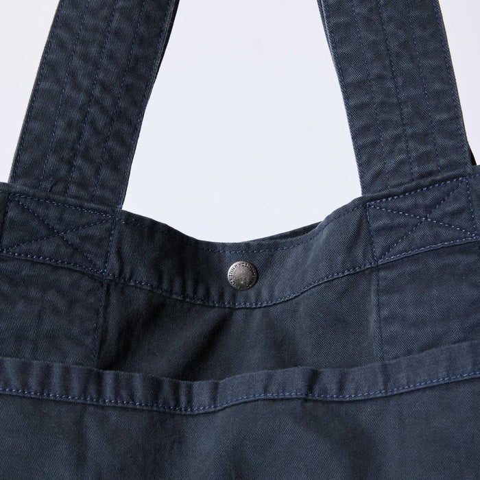 editorial image of the button snap on The Foundation Tote in Organic Navy