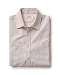 folded flatlay of The Foundry Shirt in Natural Chambray