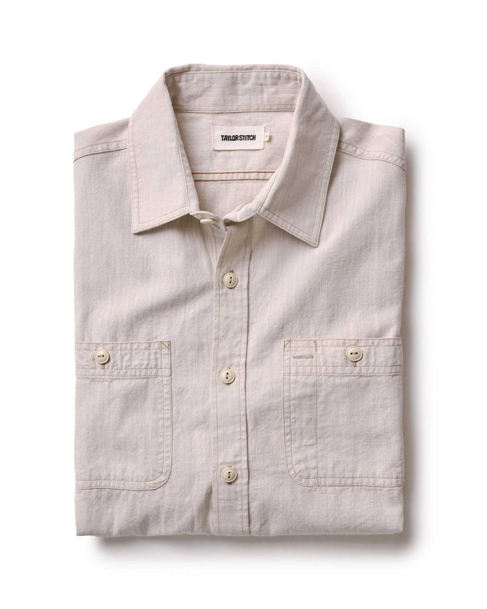 folded flatlay of The Foundry Shirt in Natural Chambray