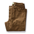 folded flatlay of The Good Acre Chore Pant in Tan Canvas