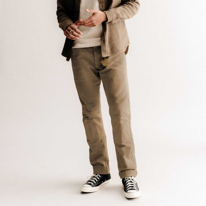 fit model posing in The Good Acre Chore Pant in Tan Canvas
