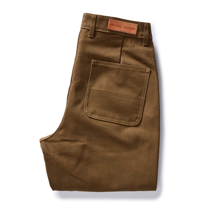 folded flatly of the back of The Good Acre Chore Pant in Tan Canvas