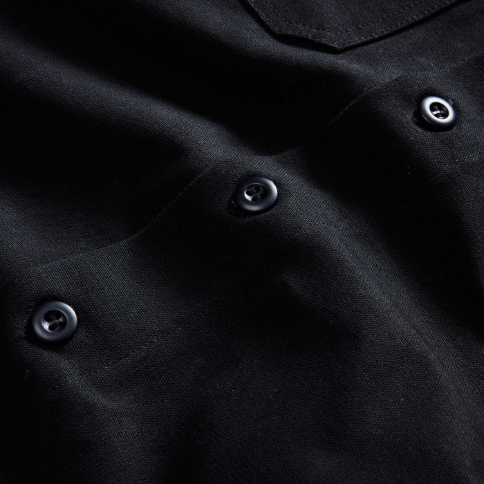 material shot of the buttons on The Good Acre Forge Overshirt in Black Canvas