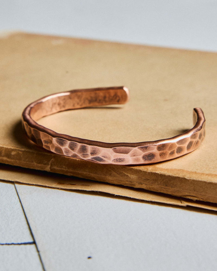 editorial image of The Hammered Cuff in Copper on a piece of paper