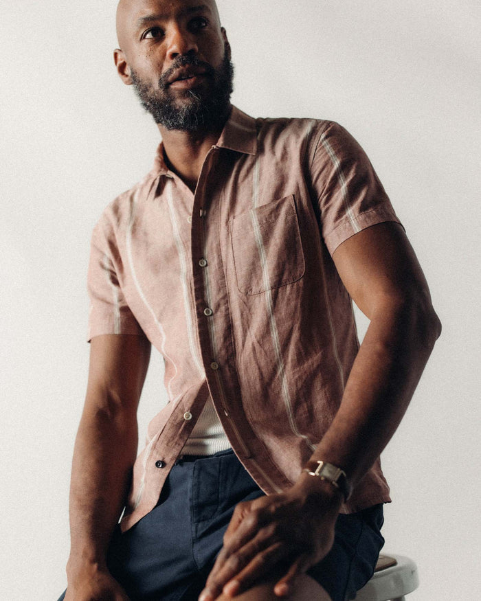 fit model showing off the buttons on The Short Sleeve Hawthorne in Dried Fig Stripe