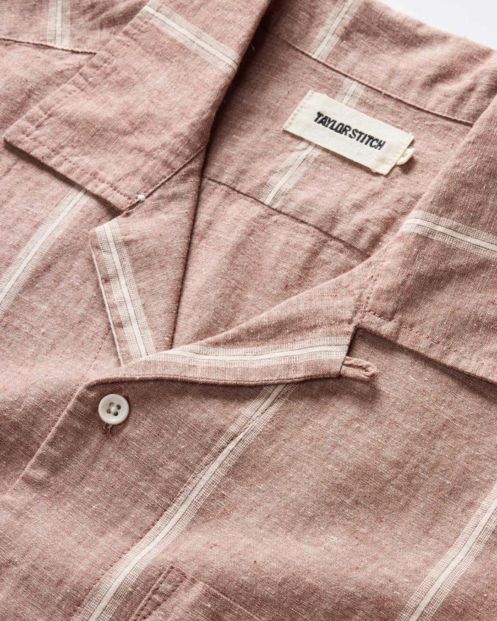 editorial image of The Short Sleeve Hawthorne in Dried Fig Stripe the beach