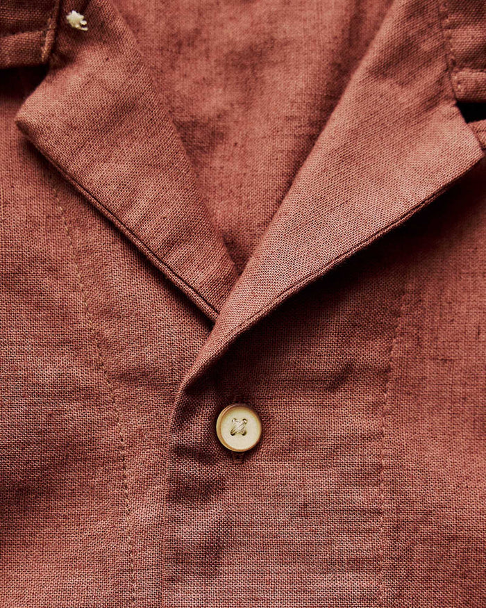 material shot of the button on The Hawthorne Shirt in Red Wine Border Eyelet